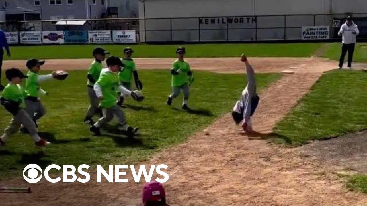 6-year-old girl cartwheels to first base during T-ball game