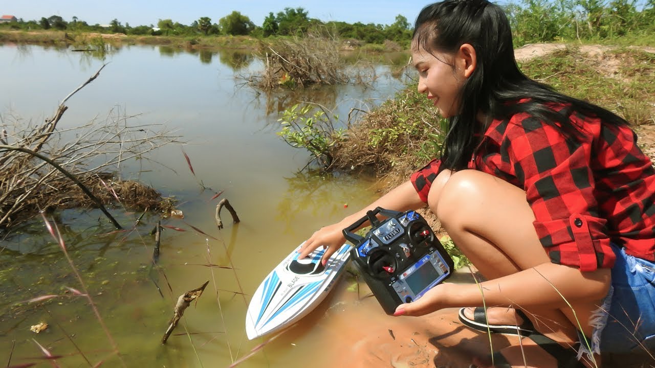 Amazing Girl Fishing By Using RC Boat In Cambodia