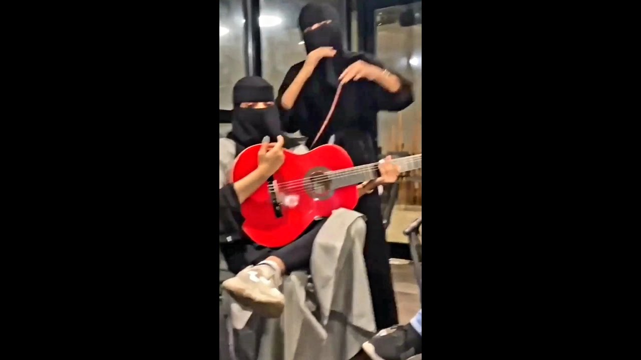 Arabic girl playing guitar  |  فتاة عربية تلعب الجيتار