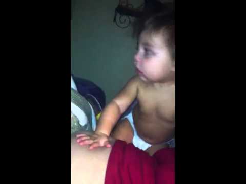 Audrey slapping my belly