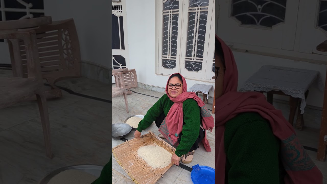 Aunty cleaning rice with a Chhajj / Supa #DogriCulture #villagelife #shorts