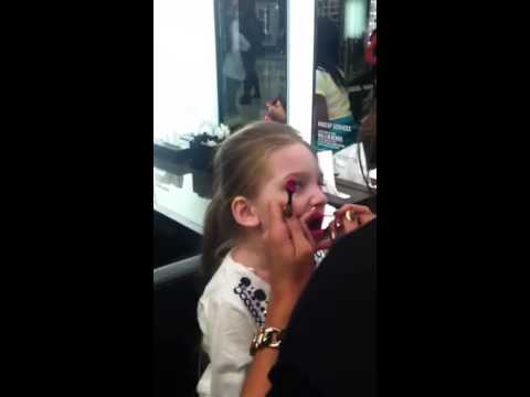 Baby celia puting on makeup at mac