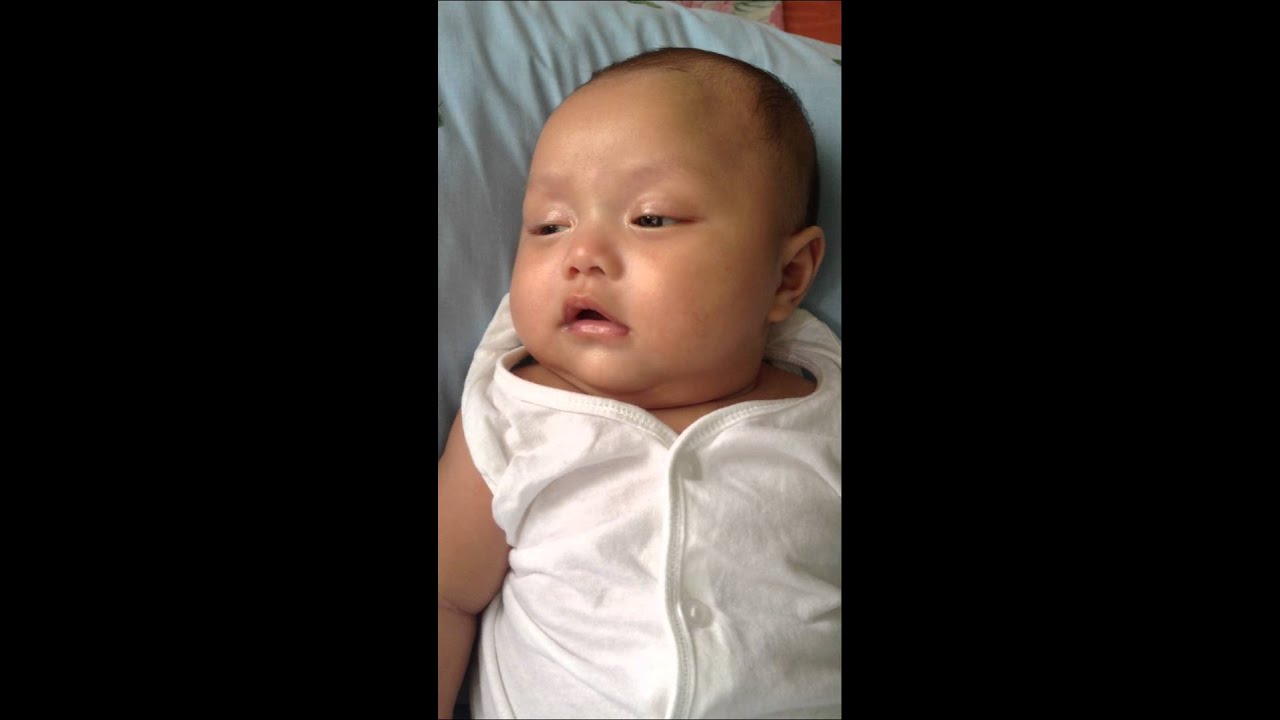 Baby Marco smiling while sleeping