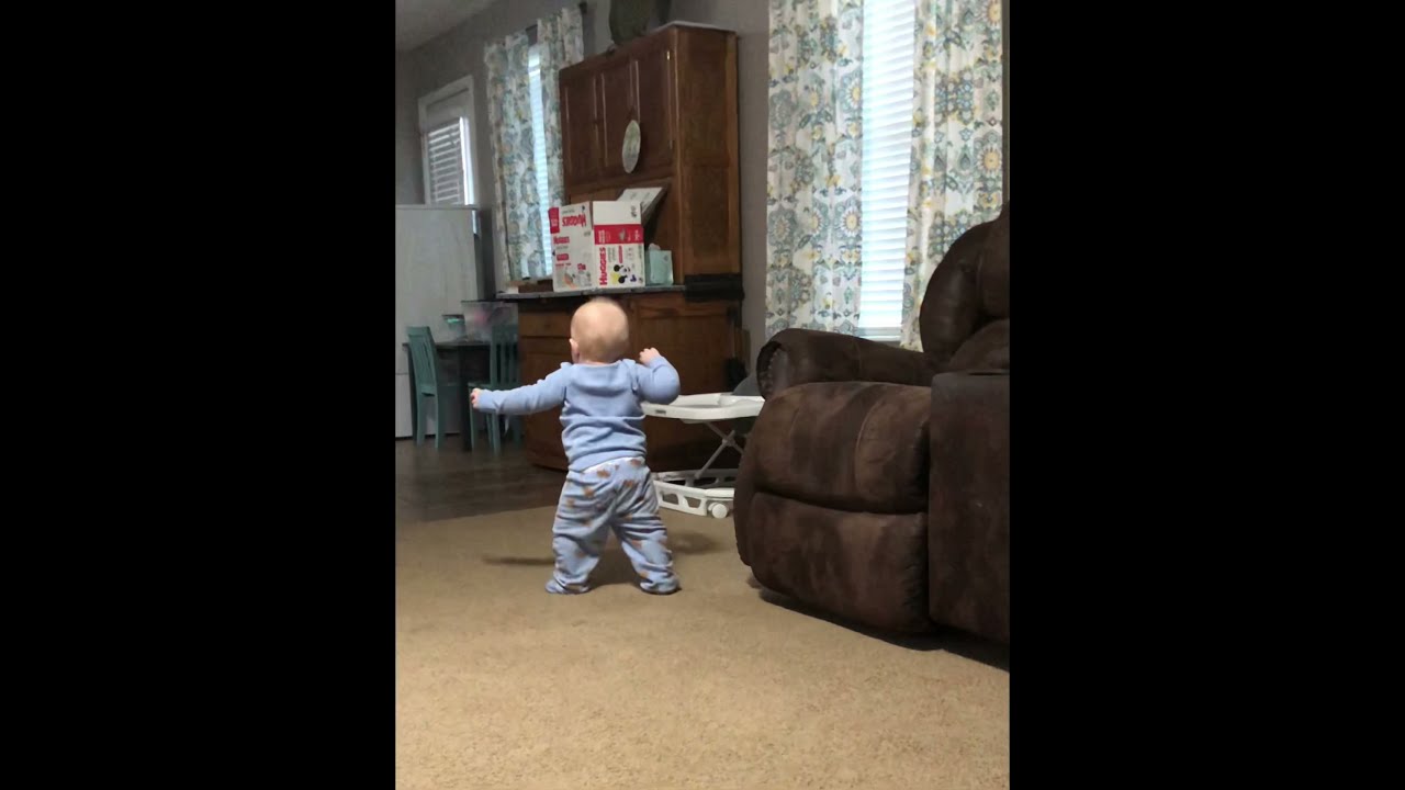 Baby slips and falls while learning to walk