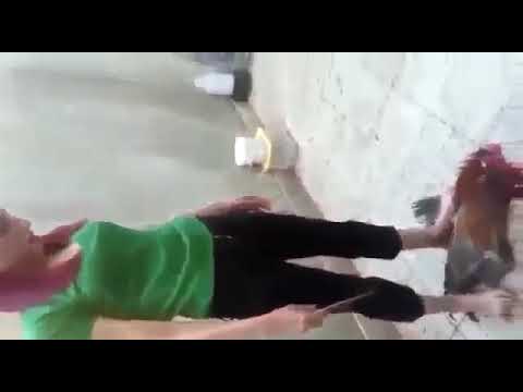 beautiful woman slaughtering a chicken