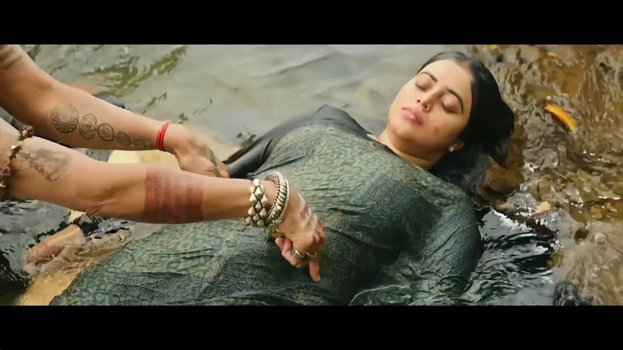 belly pressing of woman, doing CPR on indian woman
