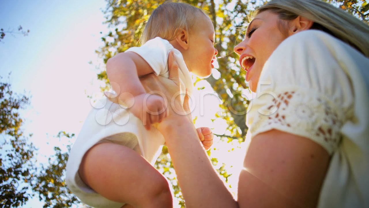 Blonde Mom and Baby Tender Kiss. Stock Footage