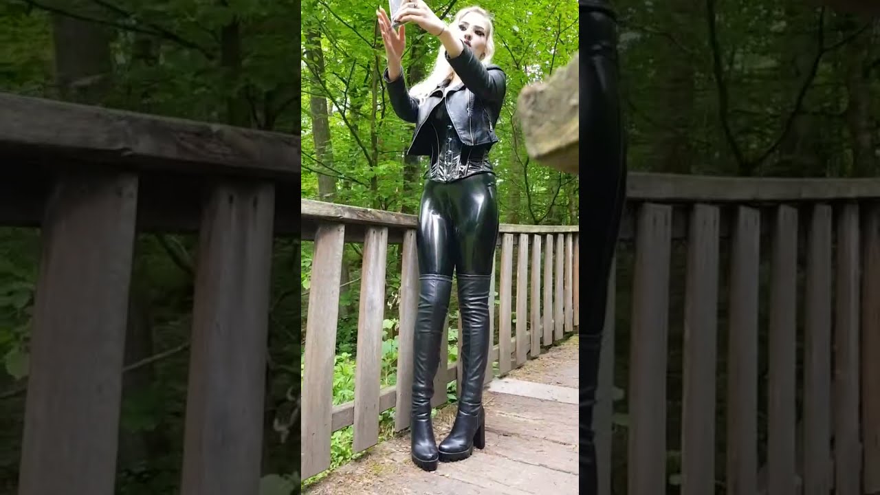blonde, thigh high boots, latex pants, leather jacket corset, and wide hips