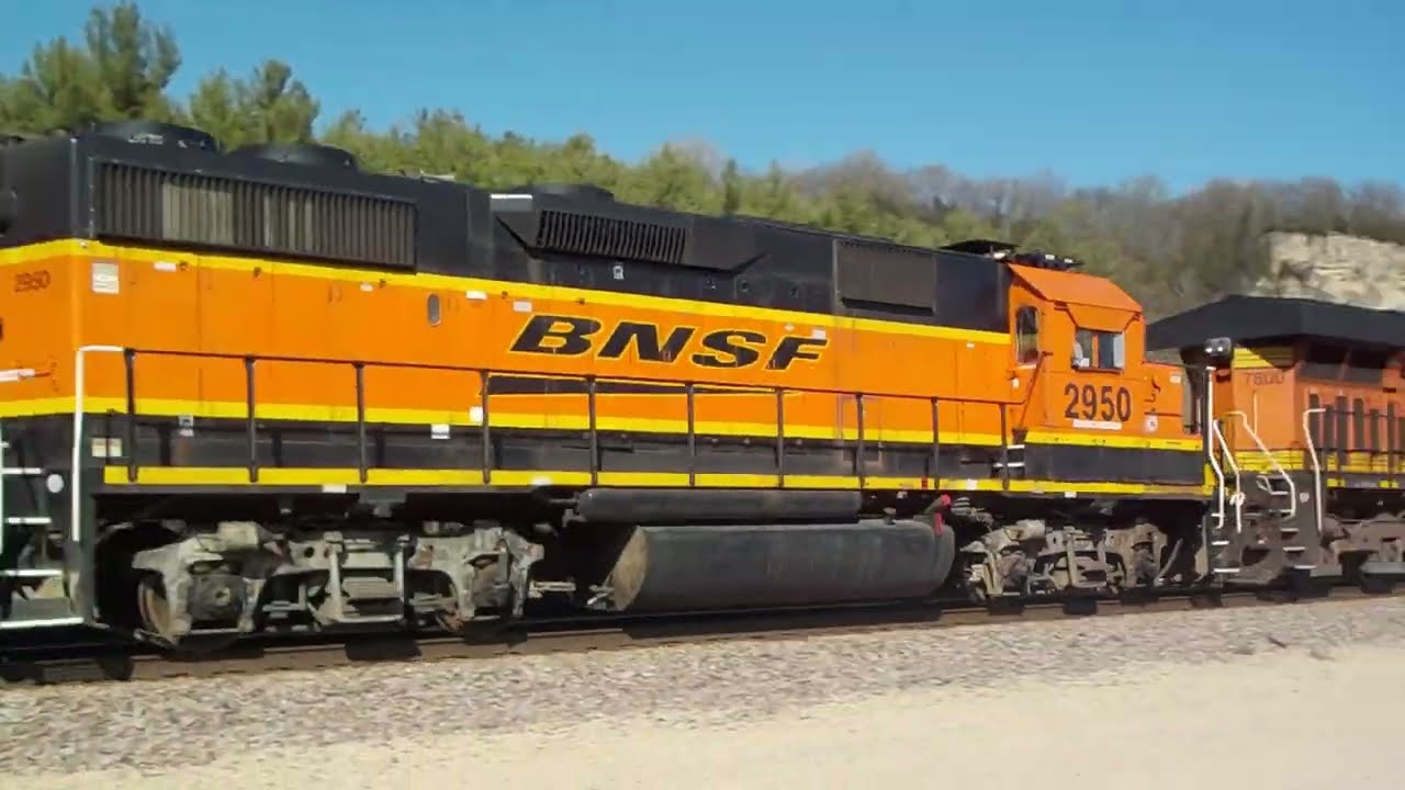 BNSF 7800 w/vehicle train & GP39-2 in transit 5/3/25