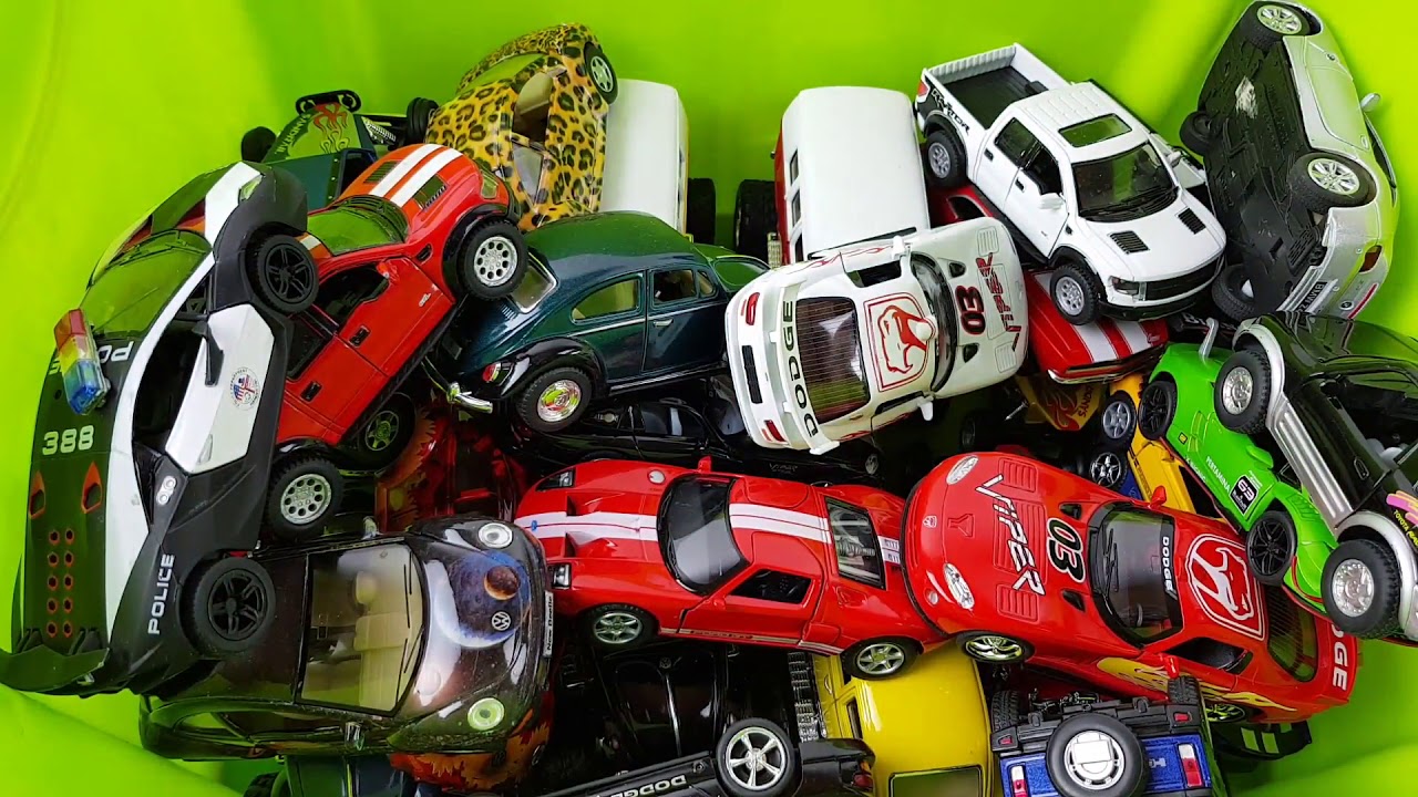 BOX FULL OF DIECAST KINSMART - Porsche Cayman S, Carrera, Viper, Lotus Exige S, Subaru Impreza WRC