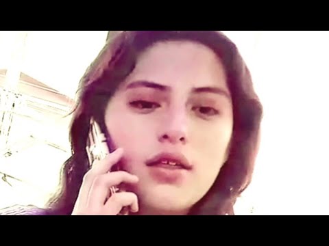(BULGE) BEAUTIFUL WOMAN TALKING ON PHONE LOOKS CURIOUSLY AT MAN IN MARKET (SOCIAL EXPERIMENT)