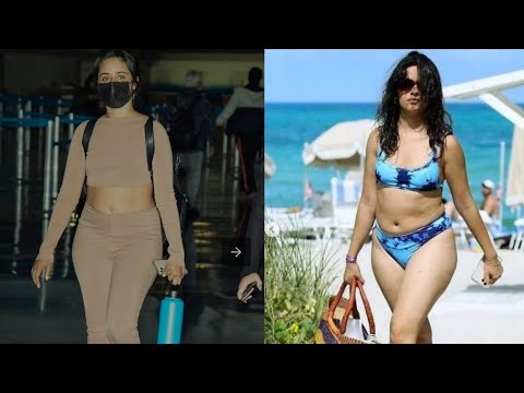 Camila Cabello shows off her toned abs in dusky pink sportswear as she touches down at JFK airport