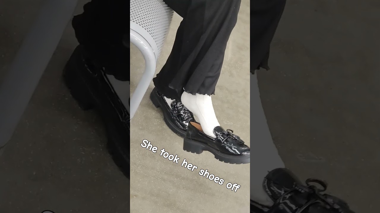 Candid shoeplay In white socks and black loafers at walmart