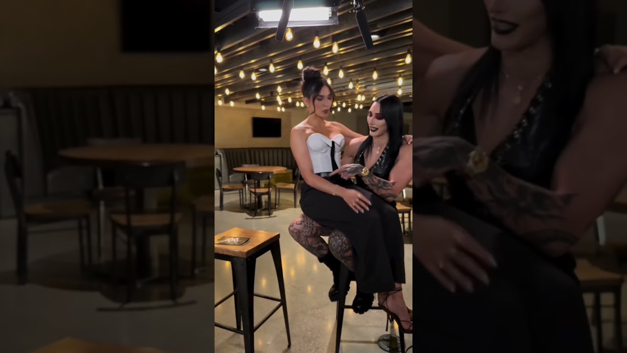 Cathy Kelly doesn't need any other chair than Rhea Ripley😳🖤 #wwe #rhearipley #cathykelley
