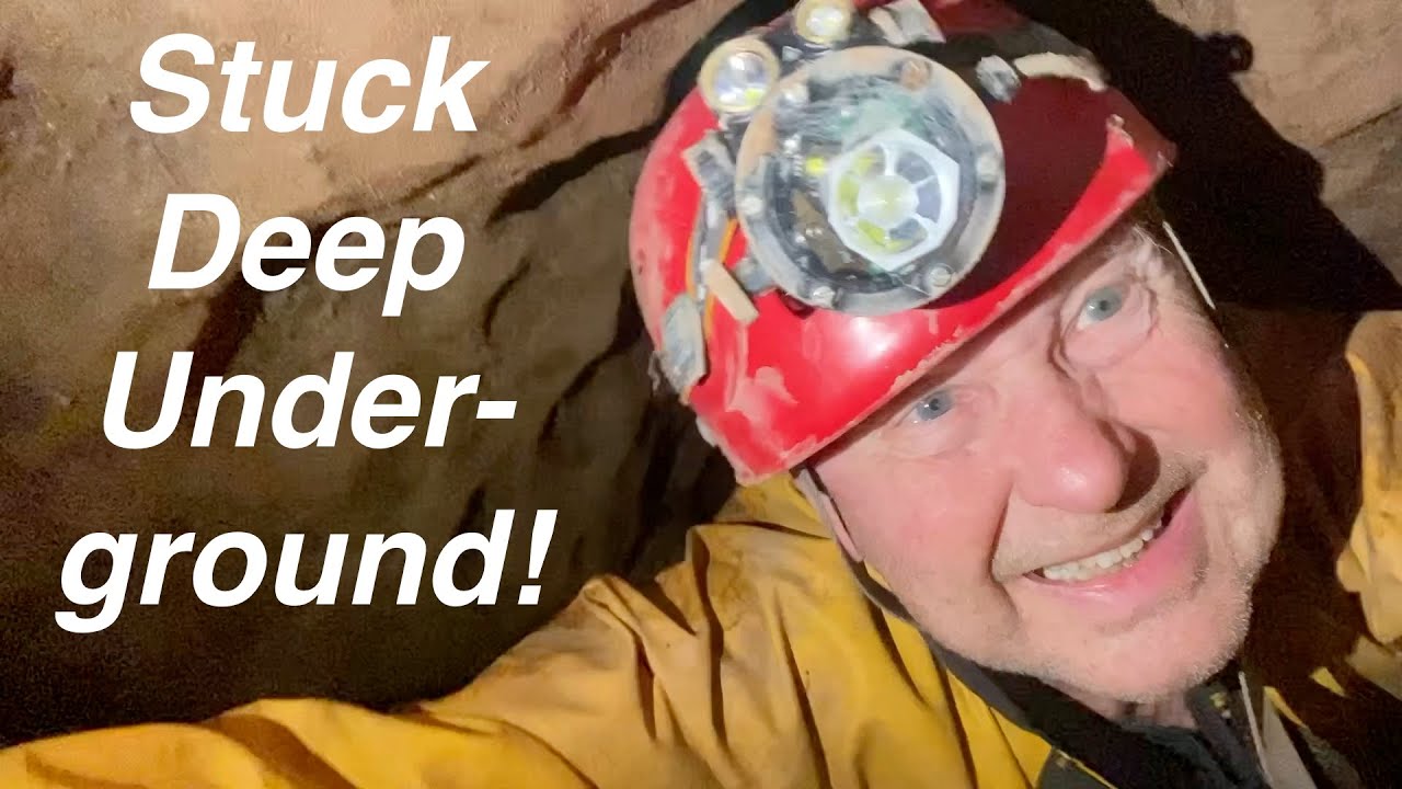 Caver Keith Attempts the Birth Canal in Cwm Dwr Quarry Cave/OFD