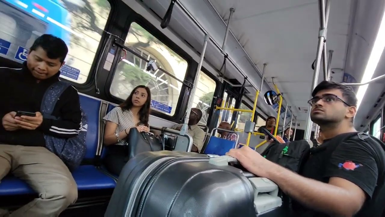 College Cutie stares at Big Bulge on the bus