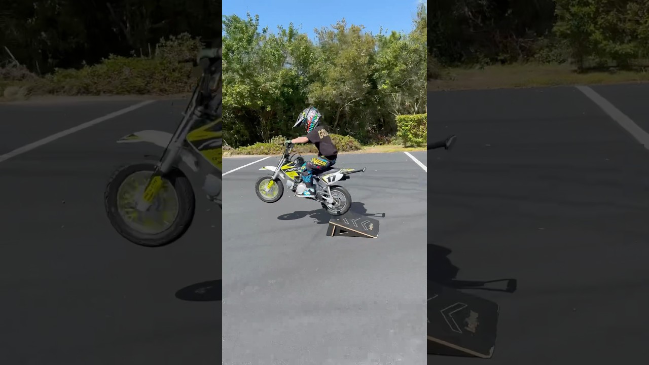 Dad and son wheelie combo team.