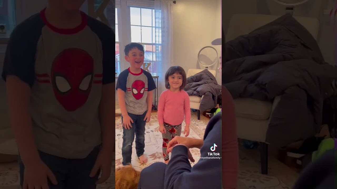 dad tickles his kids to see their reaction