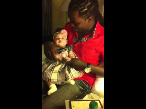 Daddy plays hokey pokey with baby