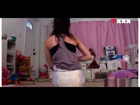 Diaper girl Nikki messing her diaper