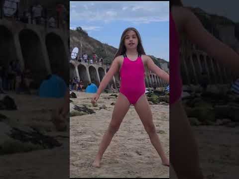 Doing gymnastics at the beach part three