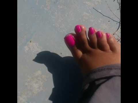 Domina DeJanea trying step on a ant with her pretty big toe