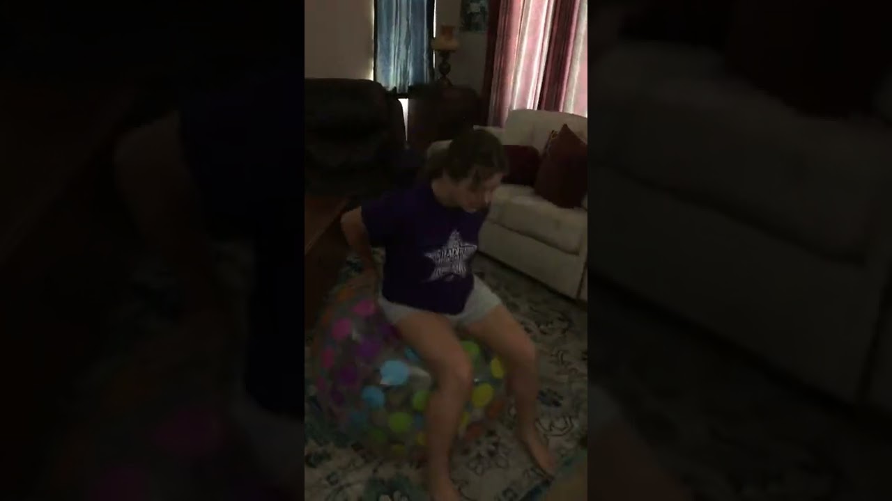 Elizabeth Bouncing On A Beach Ball