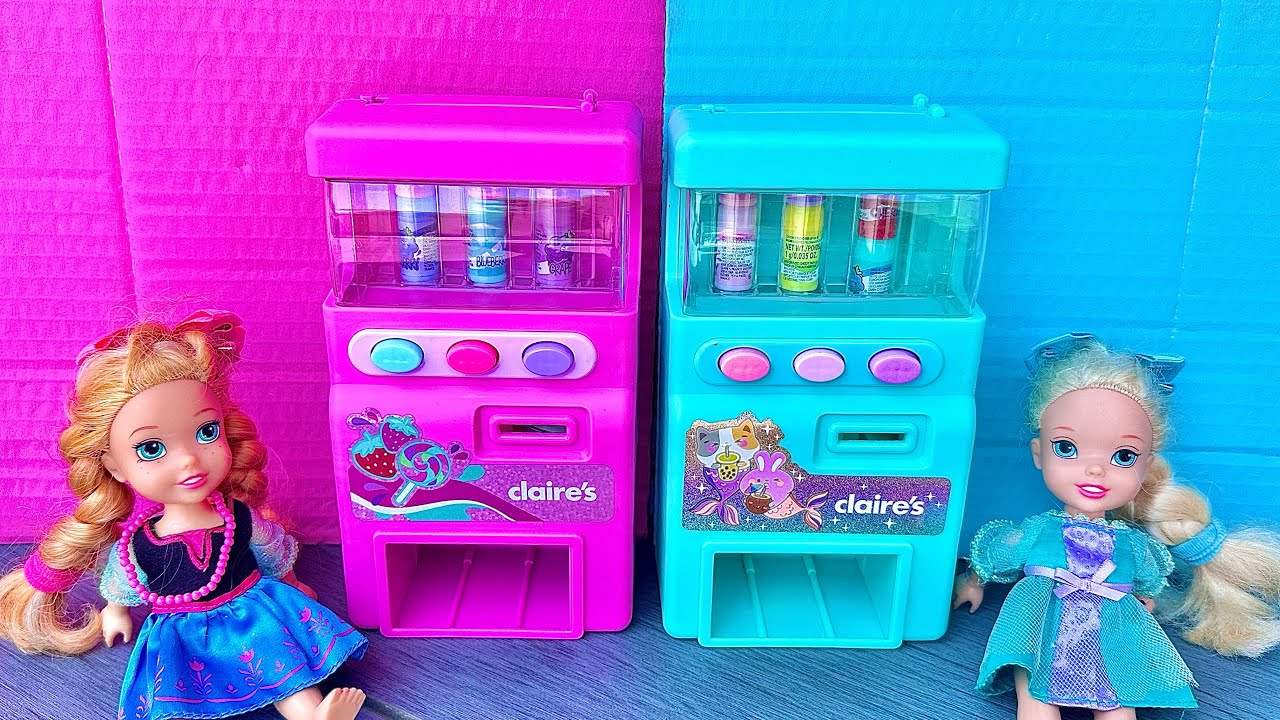 Elsa and Anna toddlers get drinks from the vending machine