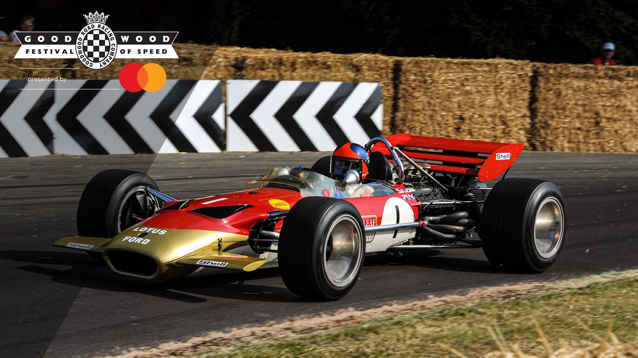 Emerson Fittipaldi leads Lotus 49 and 72 parade at Goodwood