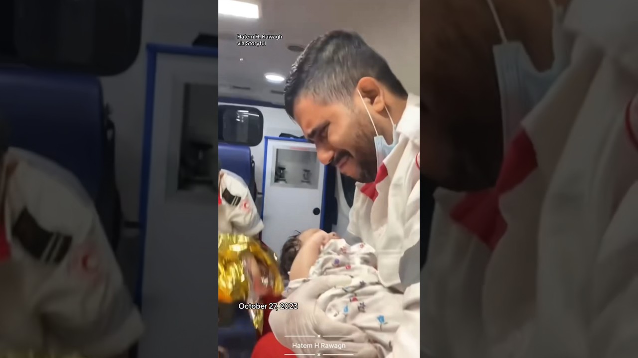 Gaza emergency worker breaks down in tears while cradling baby #shorts