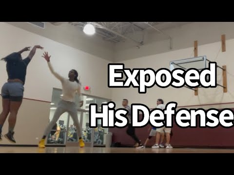 Girl challenges men’s defense in basketball game .