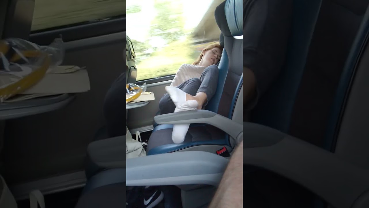 Girl sleeping in socks on the bus