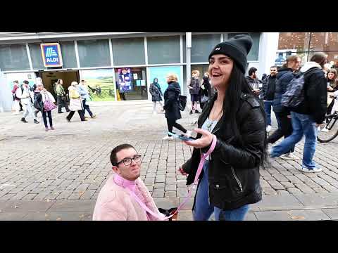 Girl spits in guys mouth on a public street