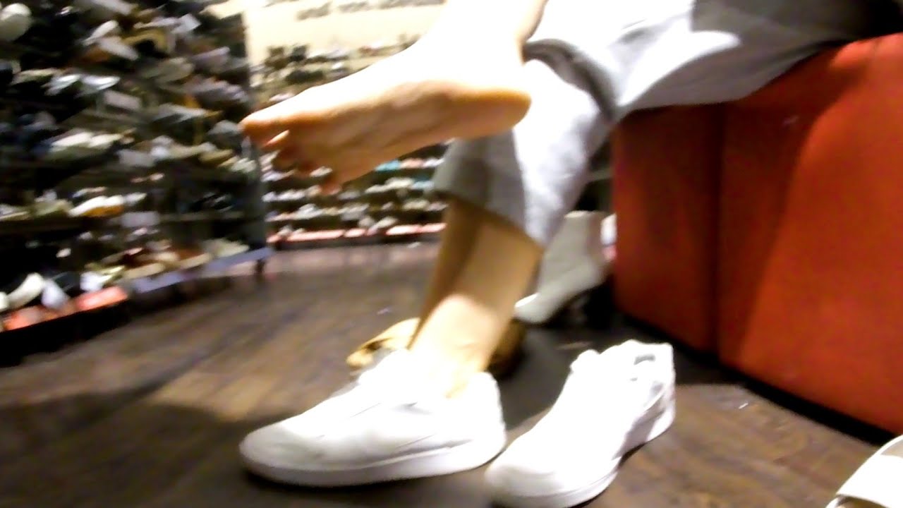 Girl wants to buy new sandals, she shows her sneakers, sandals, socks, soles,nike air force and toes