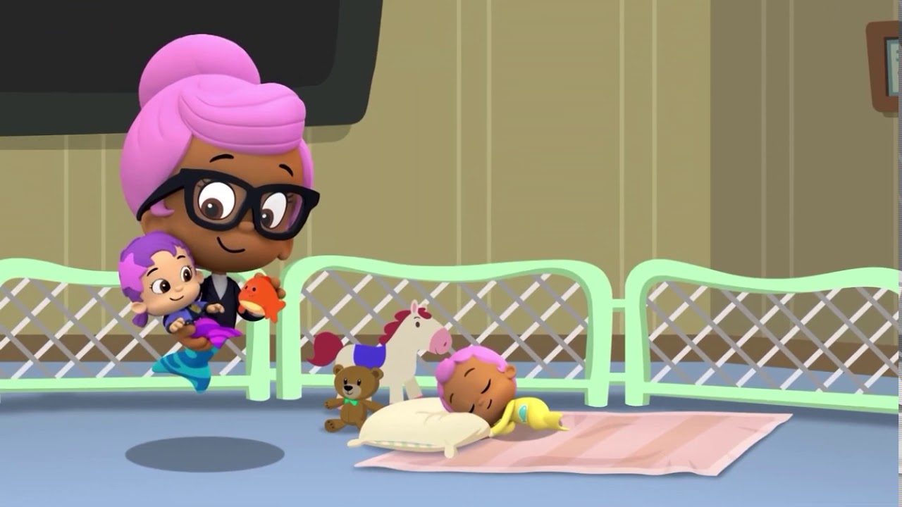Gives a toy to baby oona