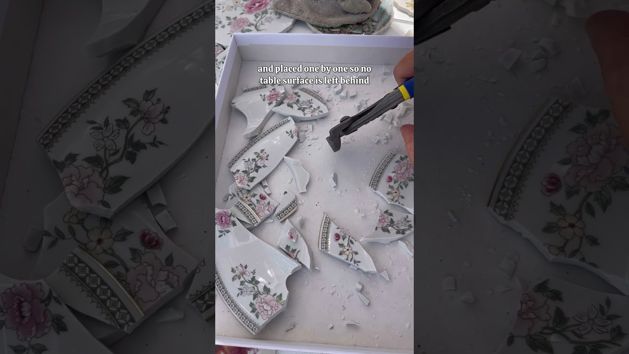 Gluing down plates one shard at a time—this mosaic table is becoming a masterpiece! 💗🍽