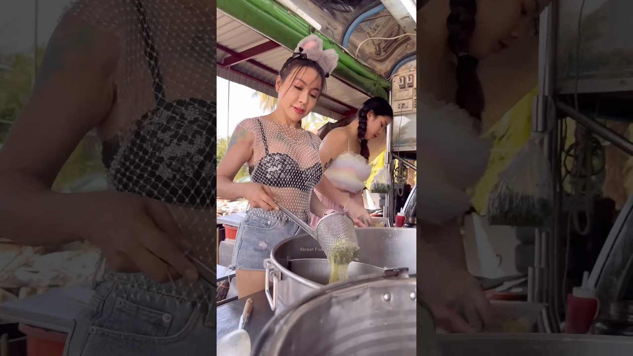 Hardworking Thai Lady Cooking Noodles on Food Truck -Thai Street Food
