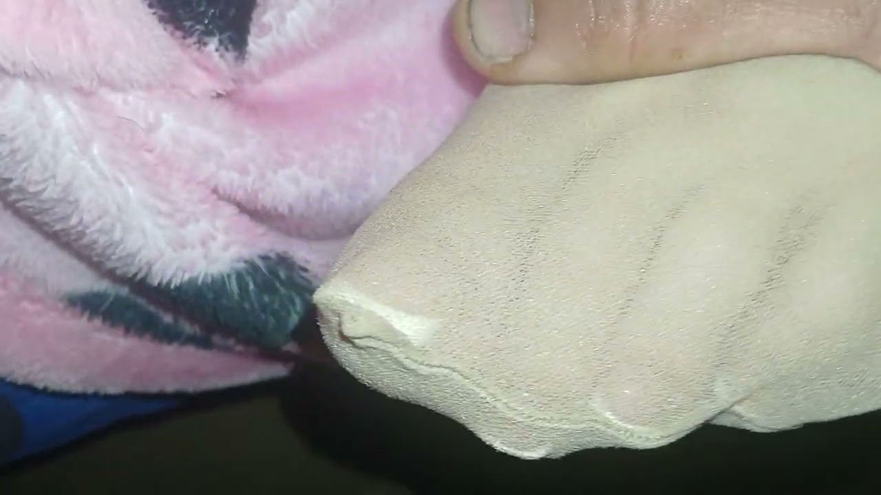 Her tired sleep feet with stocking on