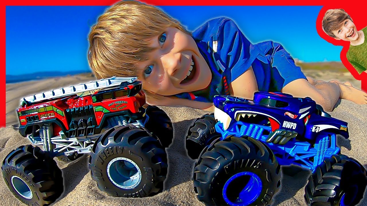 HOT WHEELS MONSTER TRUCKS AT THE BEACH WITH AXEL AND DADDY!