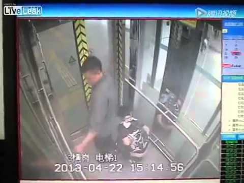 Husband keeps watch for wife shitting in elevator at subway station