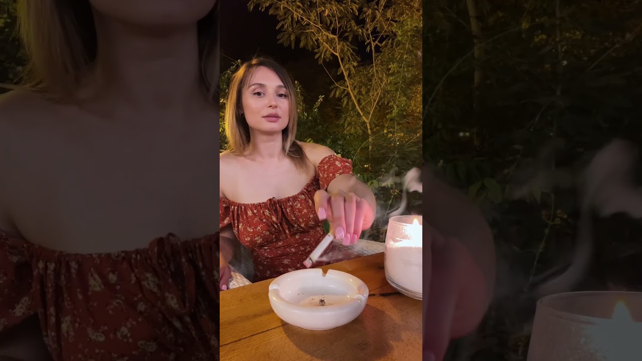 In a restaurant with a smoking girl