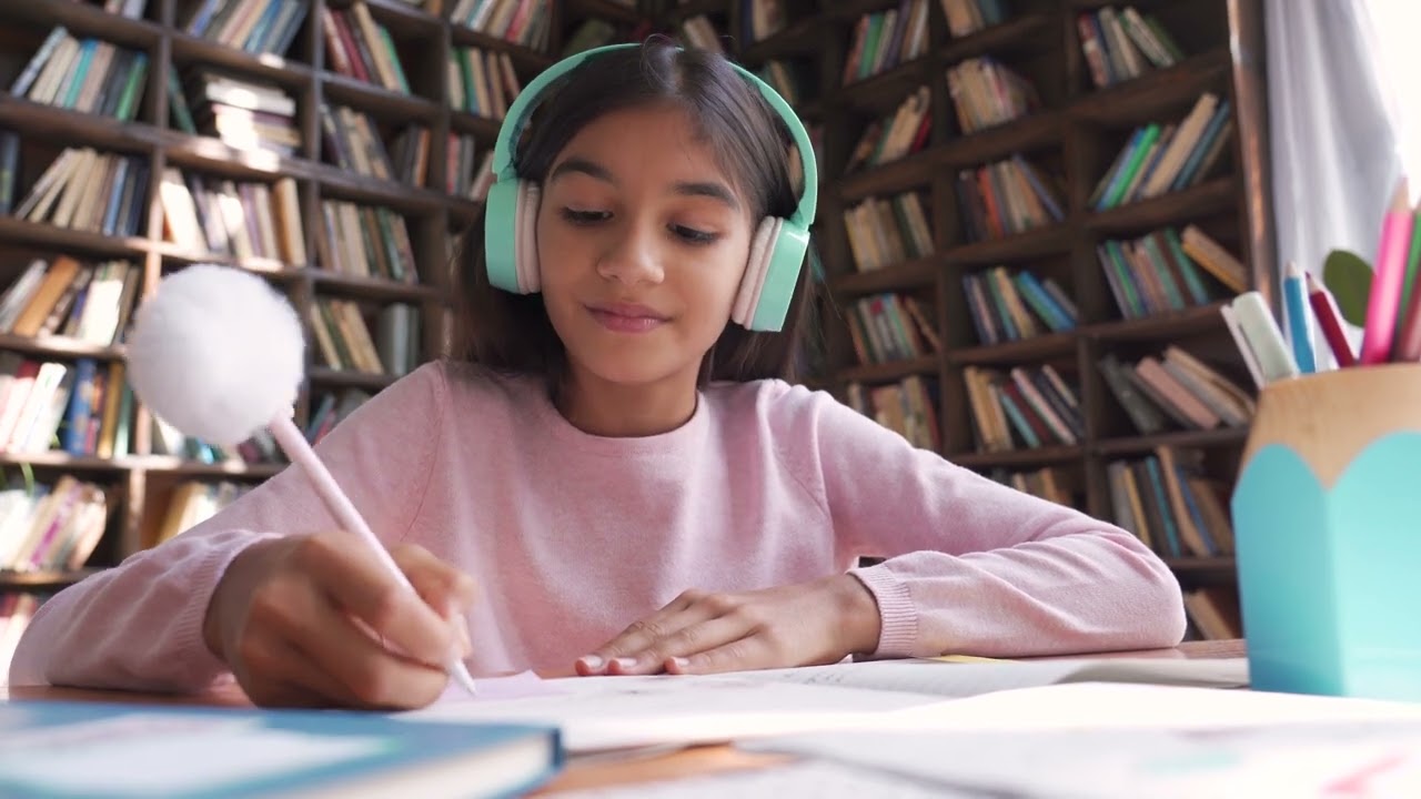 Indian School Girl Wearing Headphones Learning Online Video Call Webcam View