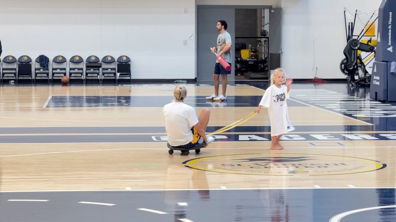 Jenny Boucek pulled by her daughter Rylie after Pacers summer practice