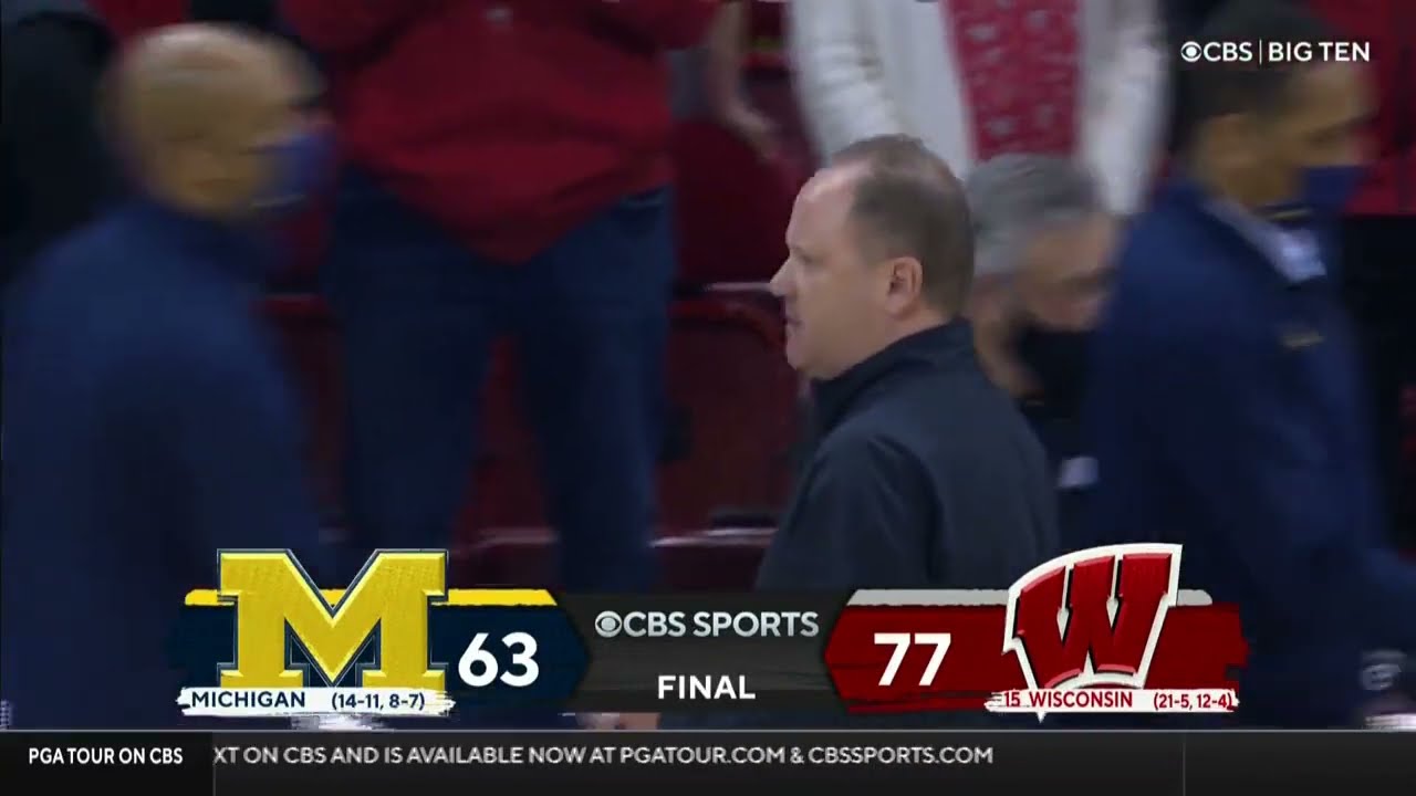 Juwan Howard throws a punch at Wisconsin assistant Joe Krabbenhoft after the Game