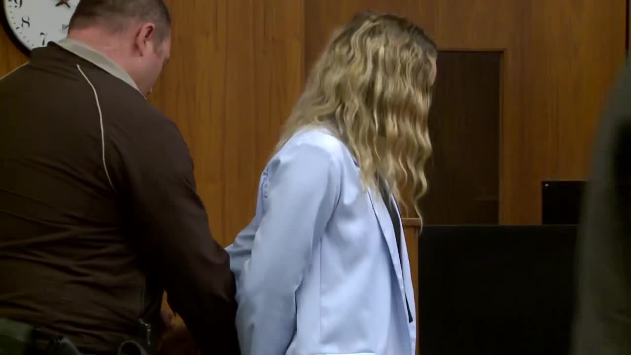 Kasey Noel being handcuffed after pleading guilty in theft, tax evasion trial