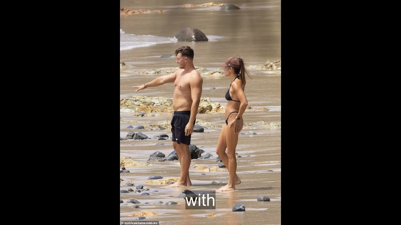 Kayla Itsines flaunts her fit body in tiny black bikini at Wategos Beach with husband Jae Woodroffe