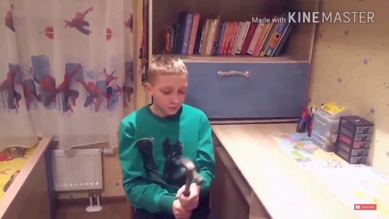 Kid breaks phone with a hammer