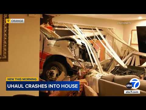 Large U-Haul truck crashes into a townhome in Orange