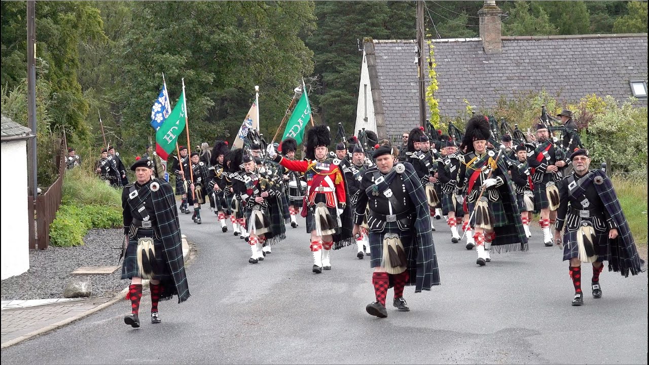 Lonach Highlanders march through Strathdon in the Cairngorms, Scotland during 2023 Lonach Gathering