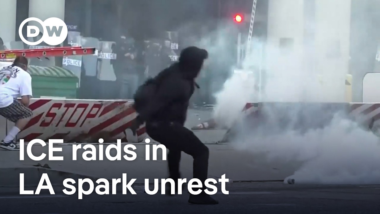Los Angeles riot police fire 'flash-bang' rounds at protesters after violent immigration raids